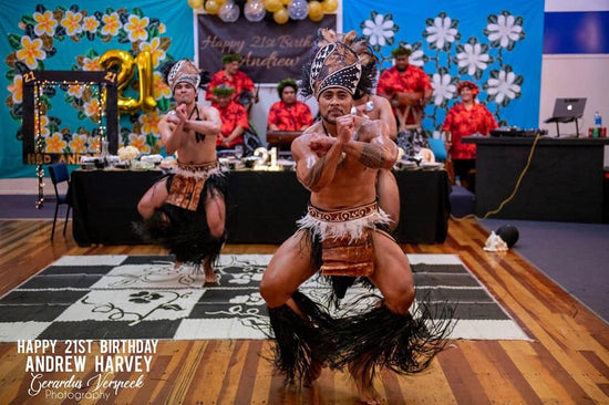 A Cook Islands warrior dancing for a birthday